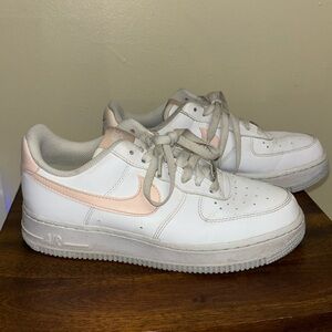 Nike Airforce 1s with pink swoosh